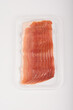 Prosciutto packaging isolated. Spanish jamon slices in plastic bag, parma ham. Sliced serrano, iberico, spanish ham, cured meat snack. Isolated on white background. Top view