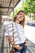 © Cavan Images - Beautiful smiling girl wearing casual summer clothes enjoys sunny day. Beauty, fashion shot.