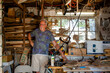 © Cavan Images - Portrait of a proud craftsman in his workshop