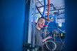 © Cavan Images - Portrait of a young male engineer working in an industrial plant, Freiburg im Breisgau, Baden-Württemberg, Germany