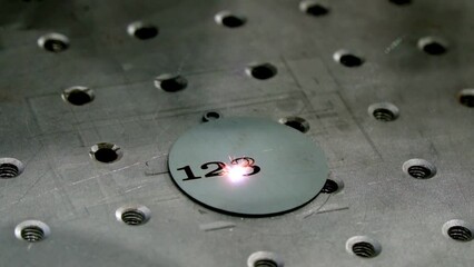 industrial production of engraving with a modern laser. additive manufacturing metal printer printin
