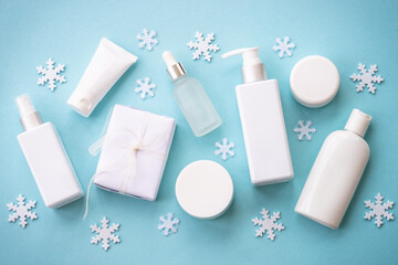 Wall Mural - winter cosmetic with holiday decorations. make up products and christmas decor on blue. christmas sa