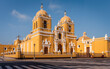 The grand cathedral with its bright yellow shade and white ornaments, Trujillo, Peru
