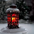 Selective focus shot of a glowing Christmas lantern covered in frost and snow