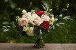 Wedding bouquet of the bride. Bridal bouquet of fresh roses and peonies flowers and green branches