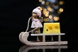 Closeup of a little angel on a sled with a piece of cheese on it and bokeh lights in the background