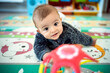 © Albert Martinez/Stocksy - Toddler Baby Playing With Toy