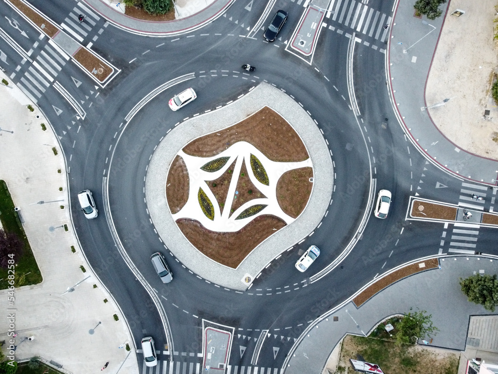 Aerial drone view of roundabout in the city. Cars moving fast. Traffic ...