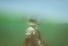Underwater Portrait Of A Man Floating In The Sea