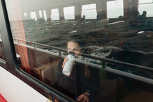 Young Woman Drinking Coffee At A Sea Ferry