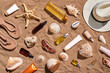 © Viktor Solomin/Stocksy - Summer cosmetics. Set of bottle and skincare products on sand