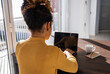 © Milles Studio/Stocksy - Female programmer using laptop at home