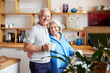 © ALTO IMAGES/Stocksy - Content elderly couple in kitchen