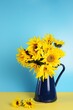 Beautiful sunflowers bouquet in a metal vase.