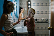 © Ezequiel Giménez/Stocksy - Mom and daughter during skin care routine in bathroom