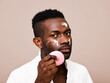 © ohlamour studio/Stocksy - Confident man using beauty products