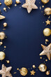 © photoguns - Luxury gold Christmas decorations on dark blue table. Elegant Christmas vertical banner design, poster, party invitation template. Frame of golden balls, stars, confetti. Top view.
