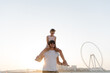 © Tanya Yatsenko/Stocksy - Daughter and father on the beach in Dubai