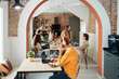 © Santi Nuñez/Stocksy - Group of young people in coworking