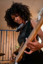 Young Woman Bass Guitar Player