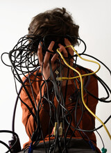 Boy Holding Messy Tech Cords