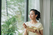 © Marc Tran/Stocksy - Portrait of business woman having fresh salad of vegetables