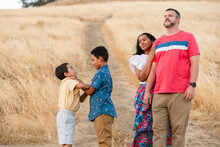 Diverse Family Feeling Good At Field