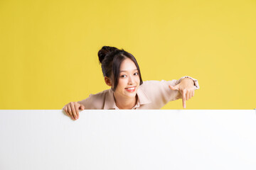 image of asian girl standing and posing with billboard