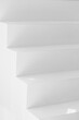 © Carter Wright/Stocksy - Close up of geometric modern white stairs with shadows