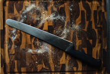 Serrated Knife On Cutting Board