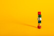© Carter Wright/Stocksy - Colorful dice pieces and dice stacked on a vibrant yellow background