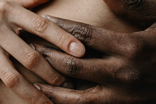 Close Up Photo Of Multiethnic Love Couple With Clasped Hands

