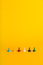 Colorful Board Game Pieces Horizontally On A Vibrant Yellow Background