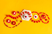 Colorful Board Game Pieces And Dice Swirling And Curling
