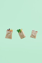 Shopping: Paper Bags Full Of Groceries Floating On Green Background
