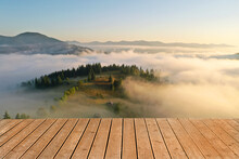 Empty Wooden Surface, Beautiful Landscape With Thick Mist And Forest In Mountains