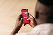 © Studio Firma/Stocksy - Man Using Dating App His on Phone