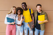 © VICTOR TORRES/Stocksy - Cheerful multiethnic students standing in university hall