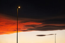 Street Lamps Under A Dramatic Sunset Sky