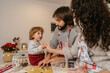 © Mal de Ojo Studio/Stocksy - Cutting christmas cookies