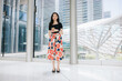 © Heng Yu/Stocksy - Asian office lady in the modern city building.