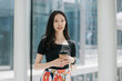 © Heng Yu/Stocksy - Asian office lady in the modern city building.