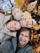 © Evgenij Yulkin/Stocksy - Family selfie in the fall