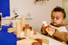 Baby Toddler Playing With Architectural Wooden Blocks 