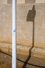 A Lamppost And Its Shadow.