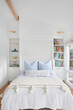© Trinette Reed/Stocksy - Bedroom in farmhouse cottage home
