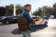 Man with backpack using smartphone