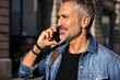 © VICTOR TORRES/Stocksy - Senior man talking on smartphone