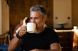 © VICTOR TORRES/Stocksy - Mature man with cup of coffee
