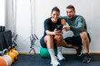 © Studio Firma/Stocksy - Man and Woman in Gym